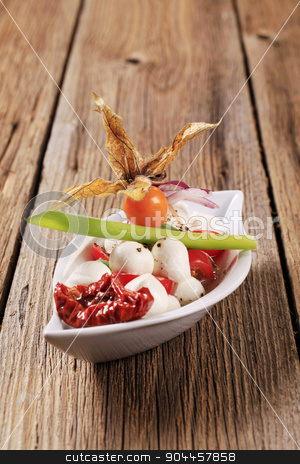To use this stock image in your creative project, please select the size you need over to the right and click the "Add to Cart" button.
Your downloaded image will come with the Cutcaster watermark removed so don’t worry about the watermark you see on this page. Caprese salad stock photo, Baby mozzarella and tomato salad in a bowl by Digifoodstock