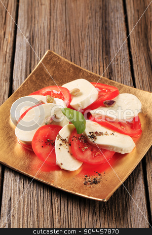 To use this stock image in your creative project, please select the size you need over to the right and click the "Add to Cart" button.
Your downloaded image will come with the Cutcaster watermark removed so don’t worry about the watermark you see on this page. Caprese salad stock photo, Slices of fresh tomato and mozzarella cheese by Digifoodstock