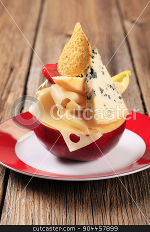 To use this stock image in your creative project, please select the size you need over to the right and click the "Add to Cart" button.
Your downloaded image will come with the Cutcaster watermark removed so don’t worry about the watermark you see on this page. Cheese appetizer stock photo, Various types of cheese on an apple by Digifoodstock