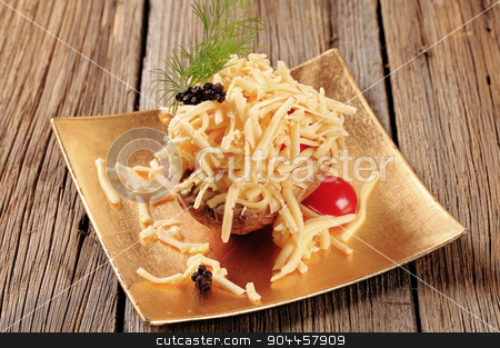 To use this stock image in your creative project, please select the size you need over to the right and click the "Add to Cart" button.
Your downloaded image will come with the Cutcaster watermark removed so don’t worry about the watermark you see on this page. Baked potato and cheese stock photo, Baked potato sprinkled with grated cheddar cheese by Digifoodstock