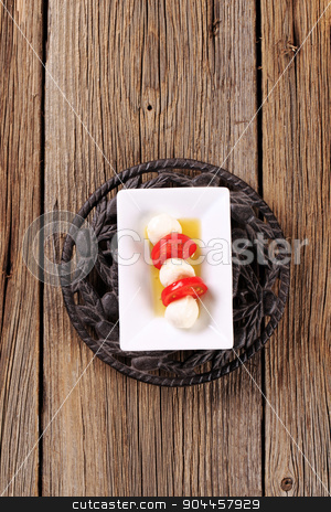 To use this stock image in your creative project, please select the size you need over to the right and click the "Add to Cart" button.
Your downloaded image will come with the Cutcaster watermark removed so don’t worry about the watermark you see on this page. Mozzarella cheese and tomato stock photo, Marinated mozzarella cheese balls and fresh tomato by Digifoodstock