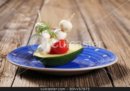 To use this stock image in your creative project, please select the size you need over to the right and click the "Add to Cart" button.
Your downloaded image will come with the Cutcaster watermark removed so don’t worry about the watermark you see on this page. Vegetarian appetizer stock photo, Fresh avocado and mini Mozzarella balls on sticks by Digifoodstock
