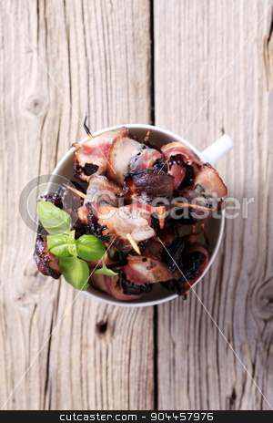 To use this stock image in your creative project, please select the size you need over to the right and click the "Add to Cart" button.
Your downloaded image will come with the Cutcaster watermark removed so don’t worry about the watermark you see on this page. Bacon wrapped prunes stock photo, Bowl of delicious bacon-wrapped prunes - overhead by Digifoodstock