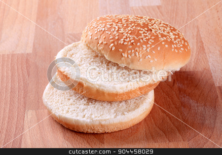 To use this stock image in your creative project, please select the size you need over to the right and click the "Add to Cart" button.
Your downloaded image will come with the Cutcaster watermark removed so don’t worry about the watermark you see on this page. Sesame seed bun stock photo, Slices of sesame seed bun - ready for hamburger by Digifoodstock