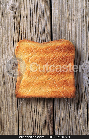 To use this stock image in your creative project, please select the size you need over to the right and click the "Add to Cart" button.
Your downloaded image will come with the Cutcaster watermark removed so don’t worry about the watermark you see on this page. Toast stock photo, Slice of toasted bread on rough wood by Digifoodstock
