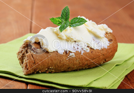 To use this stock image in your creative project, please select the size you need over to the right and click the "Add to Cart" button.
Your downloaded image will come with the Cutcaster watermark removed so don’t worry about the watermark you see on this page. Brown roll and savory spread stock photo, Whole wheat roll and savory spread - detail by Digifoodstock