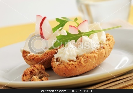 To use this stock image in your creative project, please select the size you need over to the right and click the "Add to Cart" button.
Your downloaded image will come with the Cutcaster watermark removed so don’t worry about the watermark you see on this page. Crisp rolls with cheese spread stock photo, Crisp rolls with cheese spread and radish by Digifoodstock