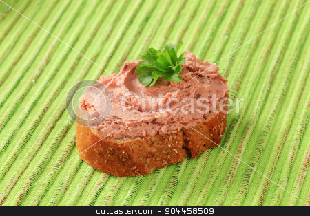 To use this stock image in your creative project, please select the size you need over to the right and click the "Add to Cart" button.
Your downloaded image will come with the Cutcaster watermark removed so don’t worry about the watermark you see on this page. Pate canape stock photo, Slice of whole grain bread roll spread with pate by Digifoodstock