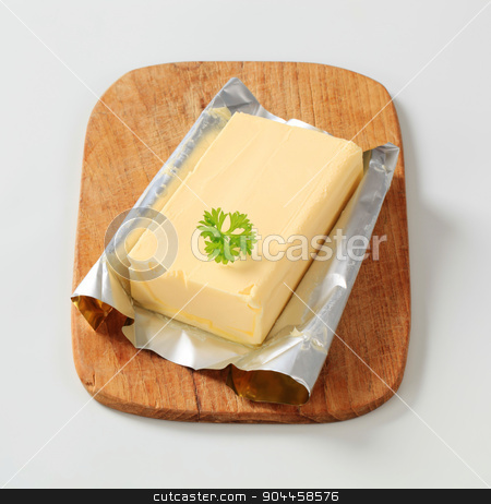 To use this stock image in your creative project, please select the size you need over to the right and click the "Add to Cart" button.
Your downloaded image will come with the Cutcaster watermark removed so don’t worry about the watermark you see on this page. Block of fresh butter stock photo, Block of fresh butter on a cutting board by Digifoodstock