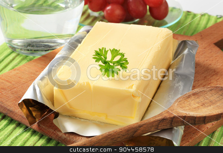 To use this stock image in your creative project, please select the size you need over to the right and click the "Add to Cart" button.
Your downloaded image will come with the Cutcaster watermark removed so don’t worry about the watermark you see on this page. Block of fresh butter stock photo, Block of fresh butter on a cutting board by Digifoodstock
