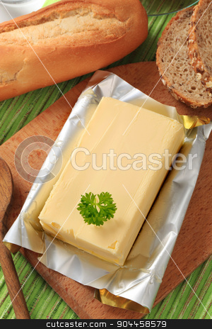 To use this stock image in your creative project, please select the size you need over to the right and click the "Add to Cart" button.
Your downloaded image will come with the Cutcaster watermark removed so don’t worry about the watermark you see on this page. Block of fresh butter stock photo, Block of fresh butter and bread - closeup by Digifoodstock