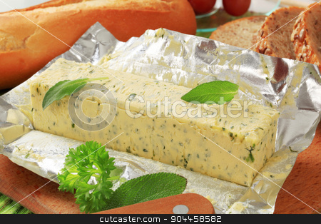 To use this stock image in your creative project, please select the size you need over to the right and click the "Add to Cart" button.
Your downloaded image will come with the Cutcaster watermark removed so don’t worry about the watermark you see on this page. Herb butter stock photo, Stick of fresh herb butter and bread by Digifoodstock