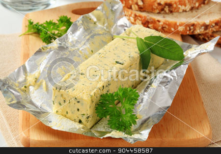 To use this stock image in your creative project, please select the size you need over to the right and click the "Add to Cart" button.
Your downloaded image will come with the Cutcaster watermark removed so don’t worry about the watermark you see on this page. Herb butter stock photo, Stick of fresh herb butter and bread by Digifoodstock