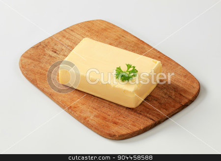 To use this stock image in your creative project, please select the size you need over to the right and click the "Add to Cart" button.
Your downloaded image will come with the Cutcaster watermark removed so don’t worry about the watermark you see on this page. Fresh butter stock photo, Block of fresh butter on a cutting board by Digifoodstock