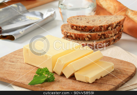 To use this stock image in your creative project, please select the size you need over to the right and click the "Add to Cart" button.
Your downloaded image will come with the Cutcaster watermark removed so don’t worry about the watermark you see on this page. Block of fresh butter stock photo, Block of fresh butter and brown bread by Digifoodstock