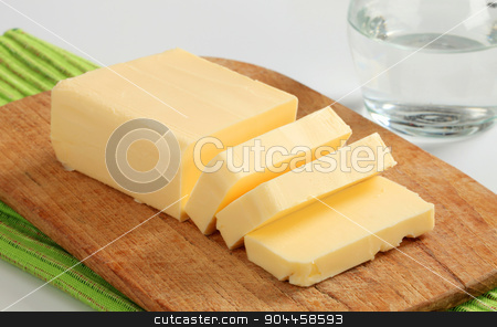 To use this stock image in your creative project, please select the size you need over to the right and click the "Add to Cart" button.
Your downloaded image will come with the Cutcaster watermark removed so don’t worry about the watermark you see on this page. Fresh butter stock photo, Block of fresh butter on a cutting board by Digifoodstock