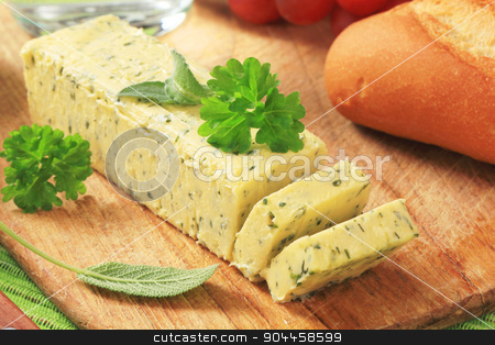 To use this stock image in your creative project, please select the size you need over to the right and click the "Add to Cart" button.
Your downloaded image will come with the Cutcaster watermark removed so don’t worry about the watermark you see on this page. Herb butter stock photo, Stick of fresh herb butter on a cutting board by Digifoodstock