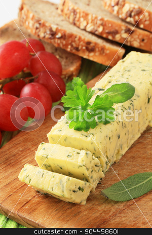 To use this stock image in your creative project, please select the size you need over to the right and click the "Add to Cart" button.
Your downloaded image will come with the Cutcaster watermark removed so don’t worry about the watermark you see on this page. Herb butter stock photo, Stick of fresh herb butter on a cutting board by Digifoodstock
