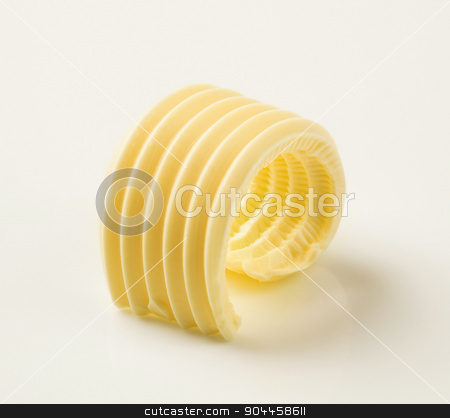 To use this stock image in your creative project, please select the size you need over to the right and click the "Add to Cart" button.
Your downloaded image will come with the Cutcaster watermark removed so don’t worry about the watermark you see on this page. Butter curl stock photo, Studio shot of a curl of fresh butter by Digifoodstock