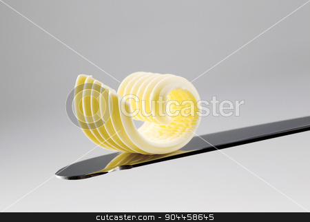 To use this stock image in your creative project, please select the size you need over to the right and click the "Add to Cart" button.
Your downloaded image will come with the Cutcaster watermark removed so don’t worry about the watermark you see on this page. Butter curl on a knife stock photo, Closeup of a butter curl on a knife
by Digifoodstock