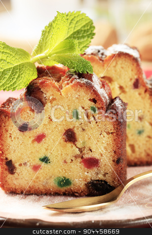 To use this stock image in your creative project, please select the size you need over to the right and click the "Add to Cart" button.
Your downloaded image will come with the Cutcaster watermark removed so don’t worry about the watermark you see on this page. Slices of fruitcake stock photo, Two pieces of fruit cake on plate by Digifoodstock