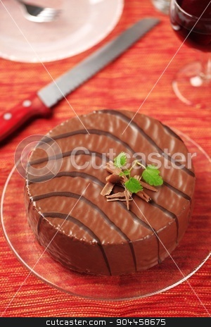 To use this stock image in your creative project, please select the size you need over to the right and click the "Add to Cart" button.
Your downloaded image will come with the Cutcaster watermark removed so don’t worry about the watermark you see on this page. Chocolate glazed cake stock photo, Delicious nut cake glazed with chocolate icing by Digifoodstock