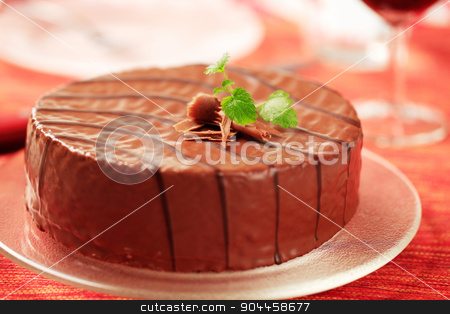 To use this stock image in your creative project, please select the size you need over to the right and click the "Add to Cart" button.
Your downloaded image will come with the Cutcaster watermark removed so don’t worry about the watermark you see on this page. Chocolate glazed cake stock photo, Delicious nut cake glazed with chocolate icing by Digifoodstock