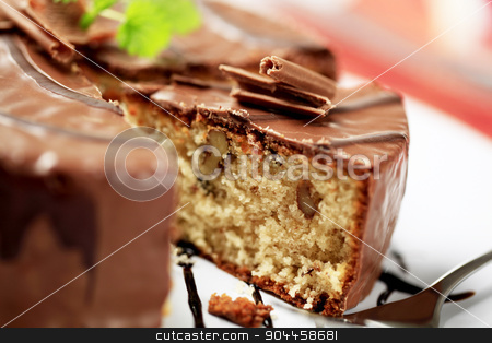 To use this stock image in your creative project, please select the size you need over to the right and click the "Add to Cart" button.
Your downloaded image will come with the Cutcaster watermark removed so don’t worry about the watermark you see on this page. Chocolate-glazed cake stock photo, Delicious nut cake glazed with chocolate icing by Digifoodstock