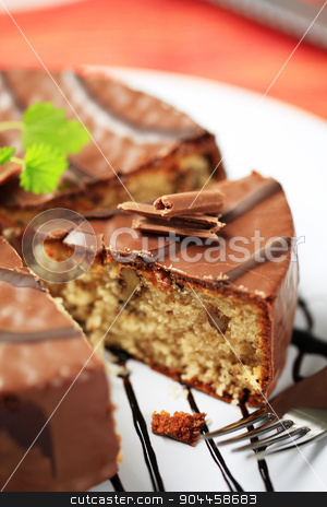 To use this stock image in your creative project, please select the size you need over to the right and click the "Add to Cart" button.
Your downloaded image will come with the Cutcaster watermark removed so don’t worry about the watermark you see on this page. Chocolate-glazed cake stock photo, Delicious nut cake glazed with chocolate icing by Digifoodstock
