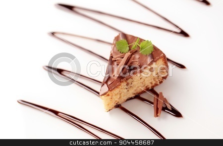 To use this stock image in your creative project, please select the size you need over to the right and click the "Add to Cart" button.
Your downloaded image will come with the Cutcaster watermark removed so don’t worry about the watermark you see on this page. Chocolate glazed cake stock photo, Delicious nut cake glazed with chocolate icing by Digifoodstock
