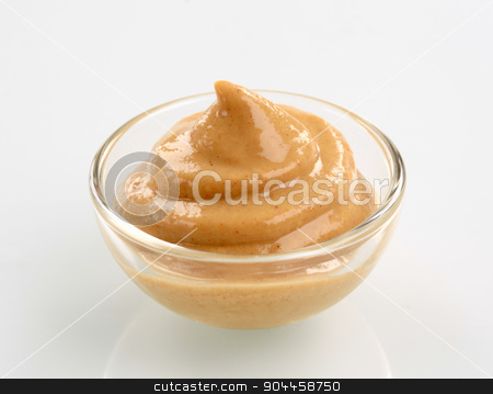To use this stock image in your creative project, please select the size you need over to the right and click the "Add to Cart" button.
Your downloaded image will come with the Cutcaster watermark removed so don’t worry about the watermark you see on this page. Mustard stock photo, Swirl of spicy mustard in a small glass bowl by Digifoodstock
