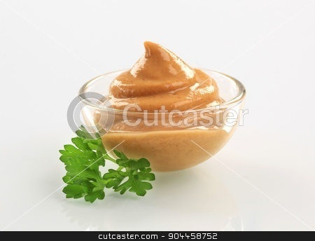 To use this stock image in your creative project, please select the size you need over to the right and click the "Add to Cart" button.
Your downloaded image will come with the Cutcaster watermark removed so don’t worry about the watermark you see on this page. Mustard stock photo, Swirl of spicy mustard in a bowl by Digifoodstock