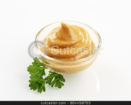 To use this stock image in your creative project, please select the size you need over to the right and click the "Add to Cart" button.
Your downloaded image will come with the Cutcaster watermark removed so don’t worry about the watermark you see on this page. Mustard stock photo, Small bowl of spicy mustard by Digifoodstock