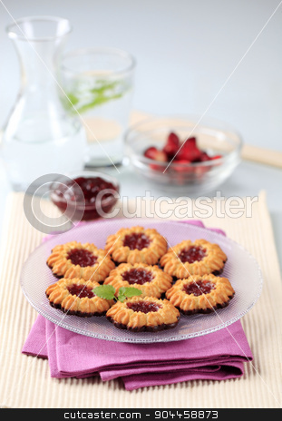 To use this stock image in your creative project, please select the size you need over to the right and click the "Add to Cart" button.
Your downloaded image will come with the Cutcaster watermark removed so don’t worry about the watermark you see on this page. Jam cookies stock photo, Chocolate dipped butter cookies with jam centers by Digifoodstock