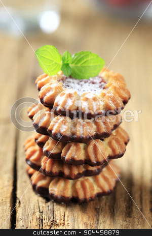 To use this stock image in your creative project, please select the size you need over to the right and click the "Add to Cart" button.
Your downloaded image will come with the Cutcaster watermark removed so don’t worry about the watermark you see on this page. Jam cookies stock photo, Stack of jam Spritz cookies by Digifoodstock