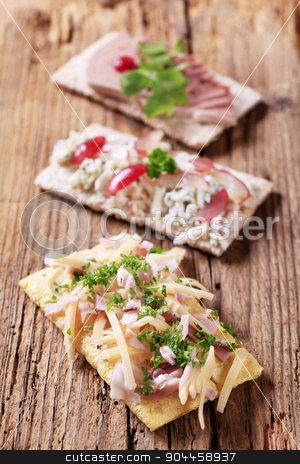 To use this stock image in your creative project, please select the size you need over to the right and click the "Add to Cart" button.
Your downloaded image will come with the Cutcaster watermark removed so don’t worry about the watermark you see on this page. Crispbread with various toppings stock photo, Three slices of crispbread with various toppings by Digifoodstock
