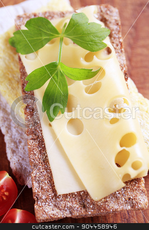 To use this stock image in your creative project, please select the size you need over to the right and click the "Add to Cart" button.
Your downloaded image will come with the Cutcaster watermark removed so don’t worry about the watermark you see on this page. Crisp bread and cheese stock photo, Variety of crispbread and a slice of Swiss cheese by Digifoodstock