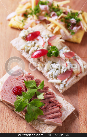 To use this stock image in your creative project, please select the size you need over to the right and click the "Add to Cart" button.
Your downloaded image will come with the Cutcaster watermark removed so don’t worry about the watermark you see on this page. Crispbread with various savory toppings stock photo, Crisp bread with various savory toppings by Digifoodstock