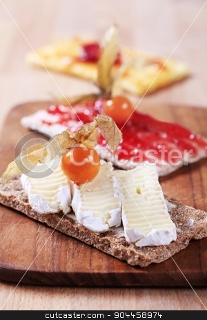 To use this stock image in your creative project, please select the size you need over to the right and click the "Add to Cart" button.
Your downloaded image will come with the Cutcaster watermark removed so don’t worry about the watermark you see on this page. Crispbread with cheese and jam stock photo, Crisp bread with cheese and jam by Digifoodstock