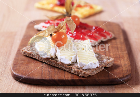 To use this stock image in your creative project, please select the size you need over to the right and click the "Add to Cart" button.
Your downloaded image will come with the Cutcaster watermark removed so don’t worry about the watermark you see on this page. Crisp bread with cheese and jam stock photo, Variety of crisp bread with cheese and jam by Digifoodstock