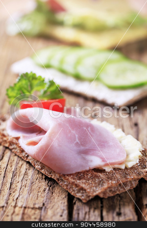 To use this stock image in your creative project, please select the size you need over to the right and click the "Add to Cart" button.
Your downloaded image will come with the Cutcaster watermark removed so don’t worry about the watermark you see on this page. Crisp bread with ham stock photo, Whole grain crispbread with ham by Digifoodstock