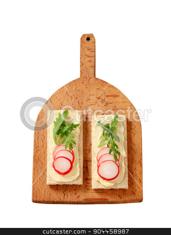 To use this stock image in your creative project, please select the size you need over to the right and click the "Add to Cart" button.
Your downloaded image will come with the Cutcaster watermark removed so don’t worry about the watermark you see on this page. Healthy appetizer stock photo, Crisp bread with butter, radish and arugula by Digifoodstock