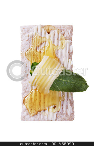 To use this stock image in your creative project, please select the size you need over to the right and click the "Add to Cart" button.
Your downloaded image will come with the Cutcaster watermark removed so don’t worry about the watermark you see on this page. Crispbread and honey stock photo, Slice of crispbread, butter and honey - overhead by Digifoodstock