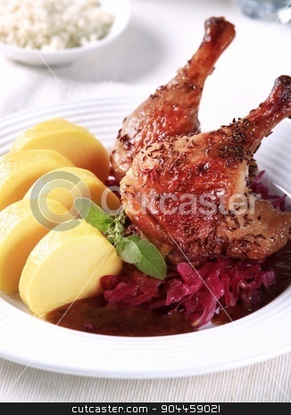 To use this stock image in your creative project, please select the size you need over to the right and click the "Add to Cart" button.
Your downloaded image will come with the Cutcaster watermark removed so don’t worry about the watermark you see on this page. Roast Duck Legs with Braised Cabbage and Potato Dumplings stock photo, Roast Duck Legs with Red Cabbage and Potato Dumplings by Digifoodstock
