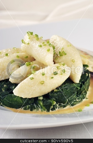 To use this stock image in your creative project, please select the size you need over to the right and click the "Add to Cart" button.
Your downloaded image will come with the Cutcaster watermark removed so don’t worry about the watermark you see on this page. Potato dumplings stock photo, Potato dumplings on a nest of spinach leaves
by Digifoodstock