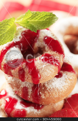 To use this stock image in your creative project, please select the size you need over to the right and click the "Add to Cart" button.
Your downloaded image will come with the Cutcaster watermark removed so don’t worry about the watermark you see on this page. Ring doughnuts stock photo, Ring doughnuts poured with syrup - detail by Digifoodstock