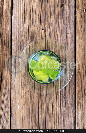To use this stock image in your creative project, please select the size you need over to the right and click the "Add to Cart" button.
Your downloaded image will come with the Cutcaster watermark removed so don’t worry about the watermark you see on this page. Glass of Mojito stock photo, Glass of Mojito drink with ice - overhead by Digifoodstock