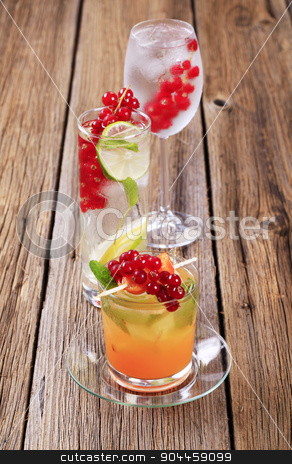 To use this stock image in your creative project, please select the size you need over to the right and click the "Add to Cart" button.
Your downloaded image will come with the Cutcaster watermark removed so don’t worry about the watermark you see on this page. Summer drinks stock photo, Glasses of iced drinks garnished with fresh fruit by Digifoodstock
