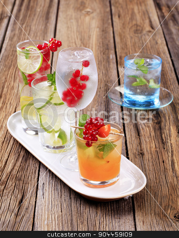 To use this stock image in your creative project, please select the size you need over to the right and click the "Add to Cart" button.
Your downloaded image will come with the Cutcaster watermark removed so don’t worry about the watermark you see on this page. Summer drinks stock photo, Glasses of iced drinks garnished with fresh fruit by Digifoodstock
