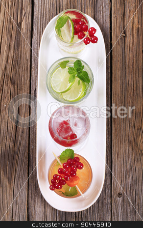 To use this stock image in your creative project, please select the size you need over to the right and click the "Add to Cart" button.
Your downloaded image will come with the Cutcaster watermark removed so don’t worry about the watermark you see on this page. Variety of iced drinks stock photo, Glasses of iced drinks garnished with fresh fruit by Digifoodstock